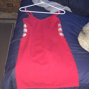 Red body con dress with cut outs on side